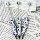close-up blue-white horseshoe IC football print bow bead showing team spirit design