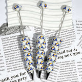 close-up blue yellow ring letter LA*R football beadable pen showing letter design and beadable barrel