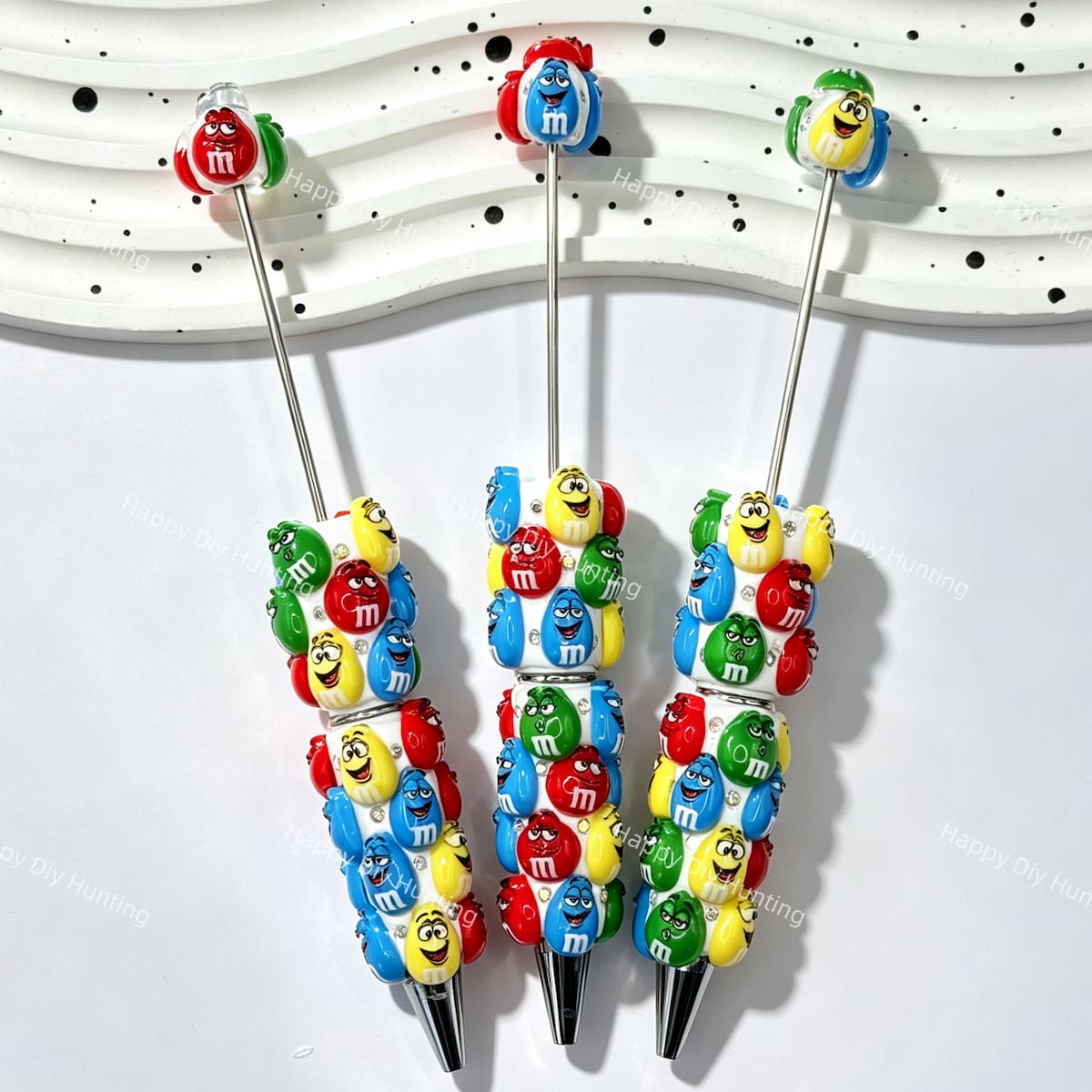close-up colorful cartoon candy beadable pen showing candy design and beadable barrel