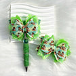 dark-haired girl with green glitter bow beads for DIY beadable pens and jewelry crafts