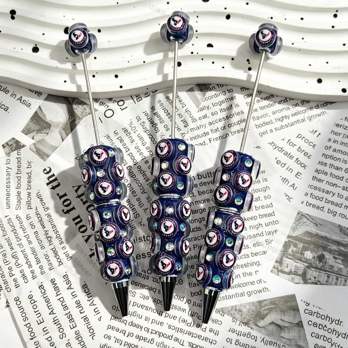 Dark navy bison football emblem sports beadable pens, circular beads printed with bison‑head patterns and iridescent rhinestones for diy handmade stationery