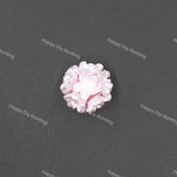 A single light pink flower-shaped craft bead with layered petals, shown on a dark gray textured background with repeating 'Happy Diy Hunting' watermarks.