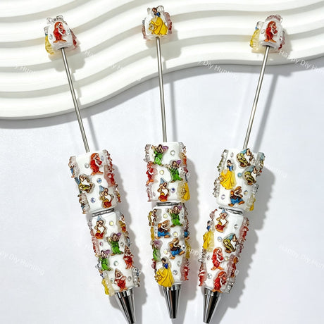 close-up fairytale maiden and seven little friends beadable pen showing storybook character designs