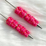 close-up pink Richard beadable pen showing colorful Richard design and beadable barrel