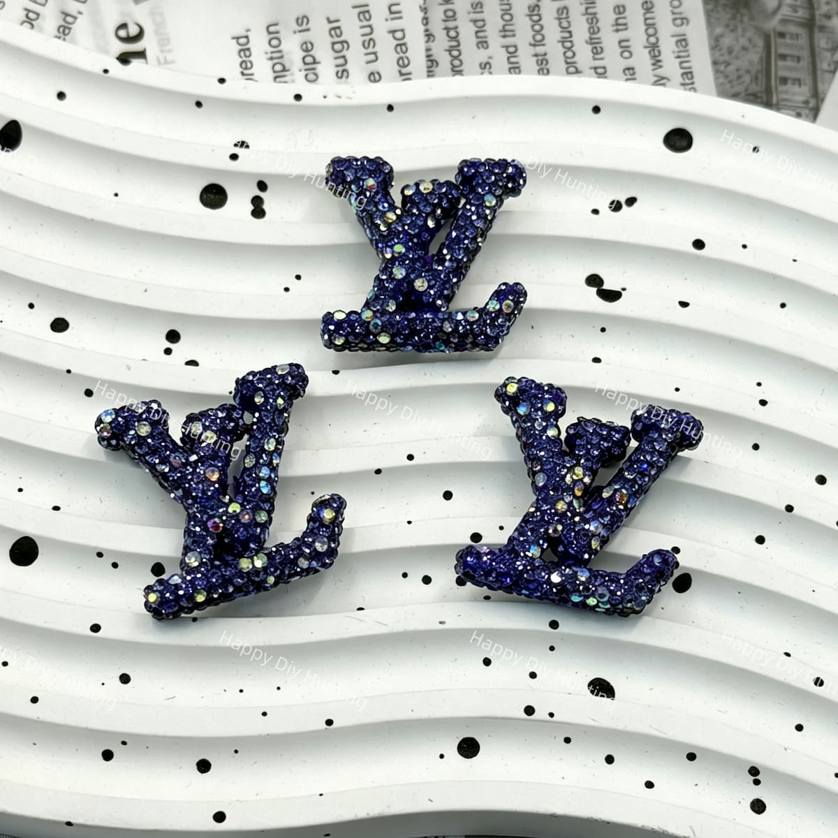 Deep navy blue AB aurora sparkly LV shape charm for resin, phone case and stationery DIY.