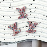 Sparkly pink‑blue mixed crystal LV shape charm, perfect for DIY pen, phone case, hair clip, resin craft decoration.