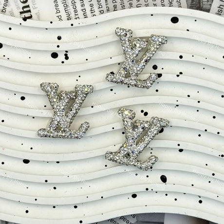 Silver tone AB iridescent rhinestone LV charm for handmade jewelry and cream glue projects.