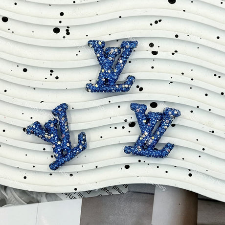 Light sky‑blue AB glitter LV shape charm for DIY pen, hair clip and resin crafts.