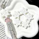 Close‑up of embossed snowflake silicone focal beads in pink blue white for diy pen crafts
