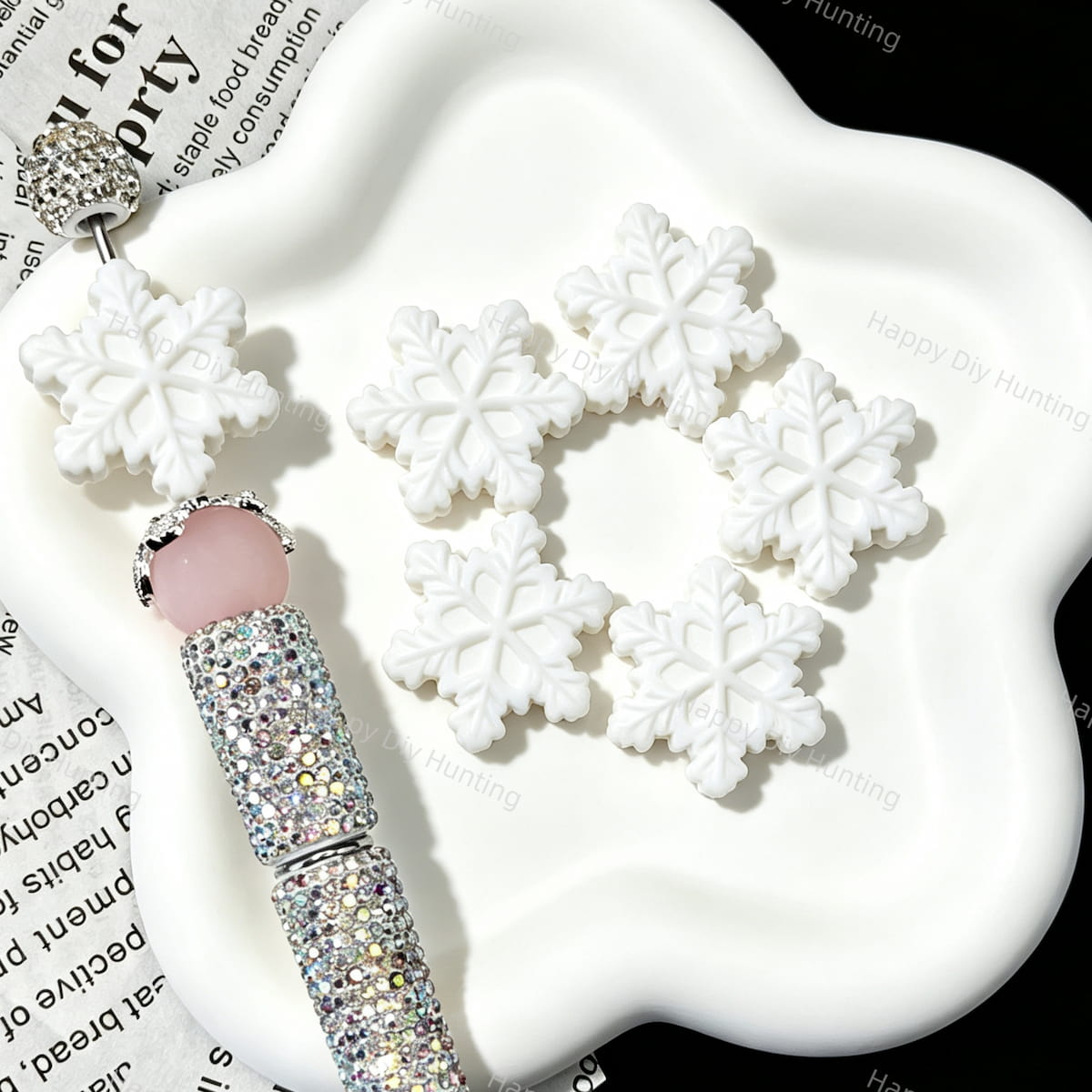 Close‑up of embossed snowflake silicone focal beads in pink blue white for diy pen crafts