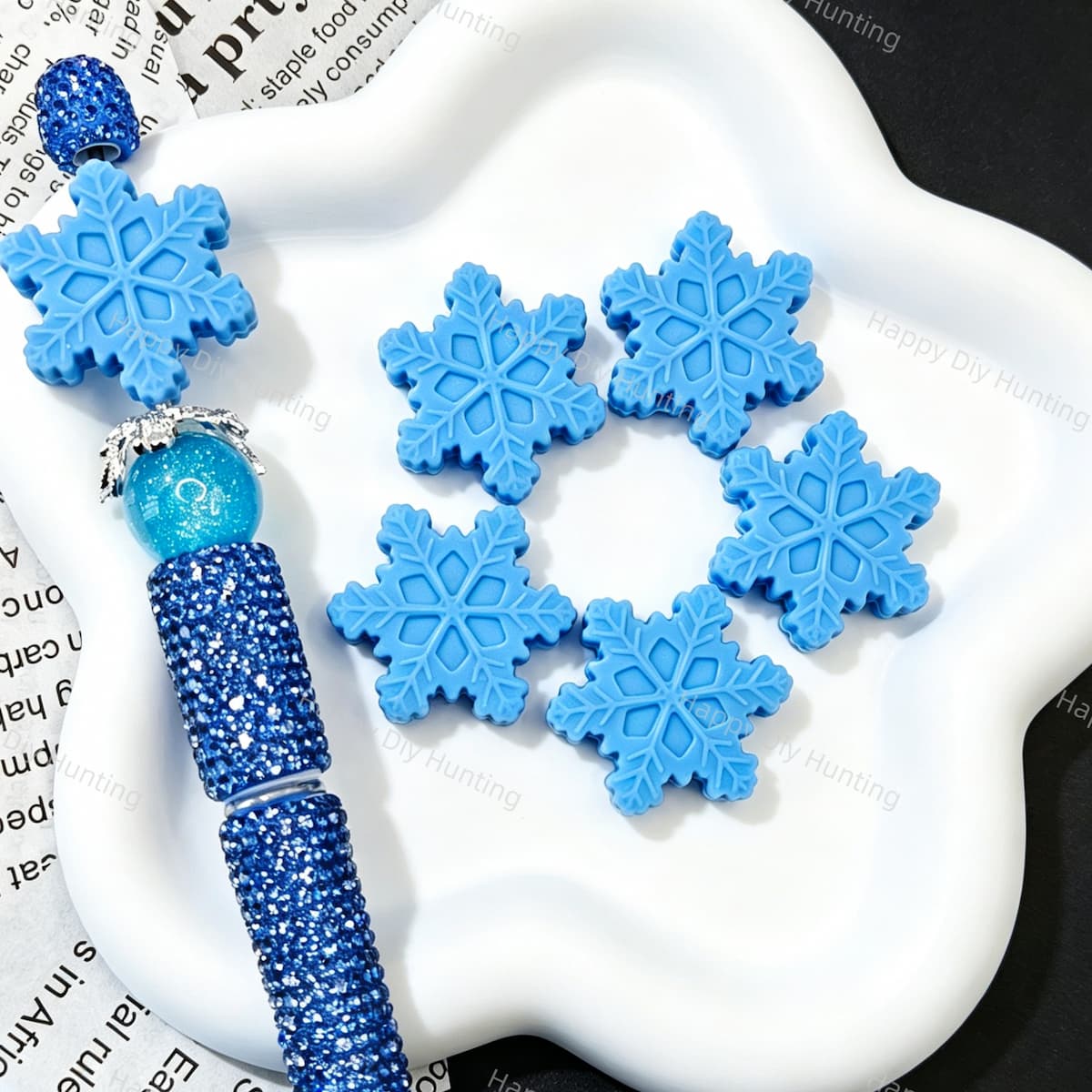 Finished beadable pen examples assembled with snowflake silicone focal beads