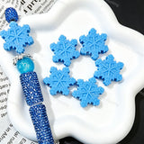 Finished beadable pen examples assembled with snowflake silicone focal beads