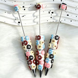 close-up multicolor candy-shape beadable pen showing candy design and beadable barrel