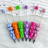 close-up multicolor Richard beadable pen showing colorful Richard design and beadable barrel