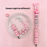 Piglet inspired pink beadable pen set with a cute pink pig cartoon character topper, matching silicone beads, and silver rhinestone spacers.