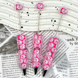 close-up pink bottle cap cartoon character beadable pen showing cute figurine design and pen topper fit