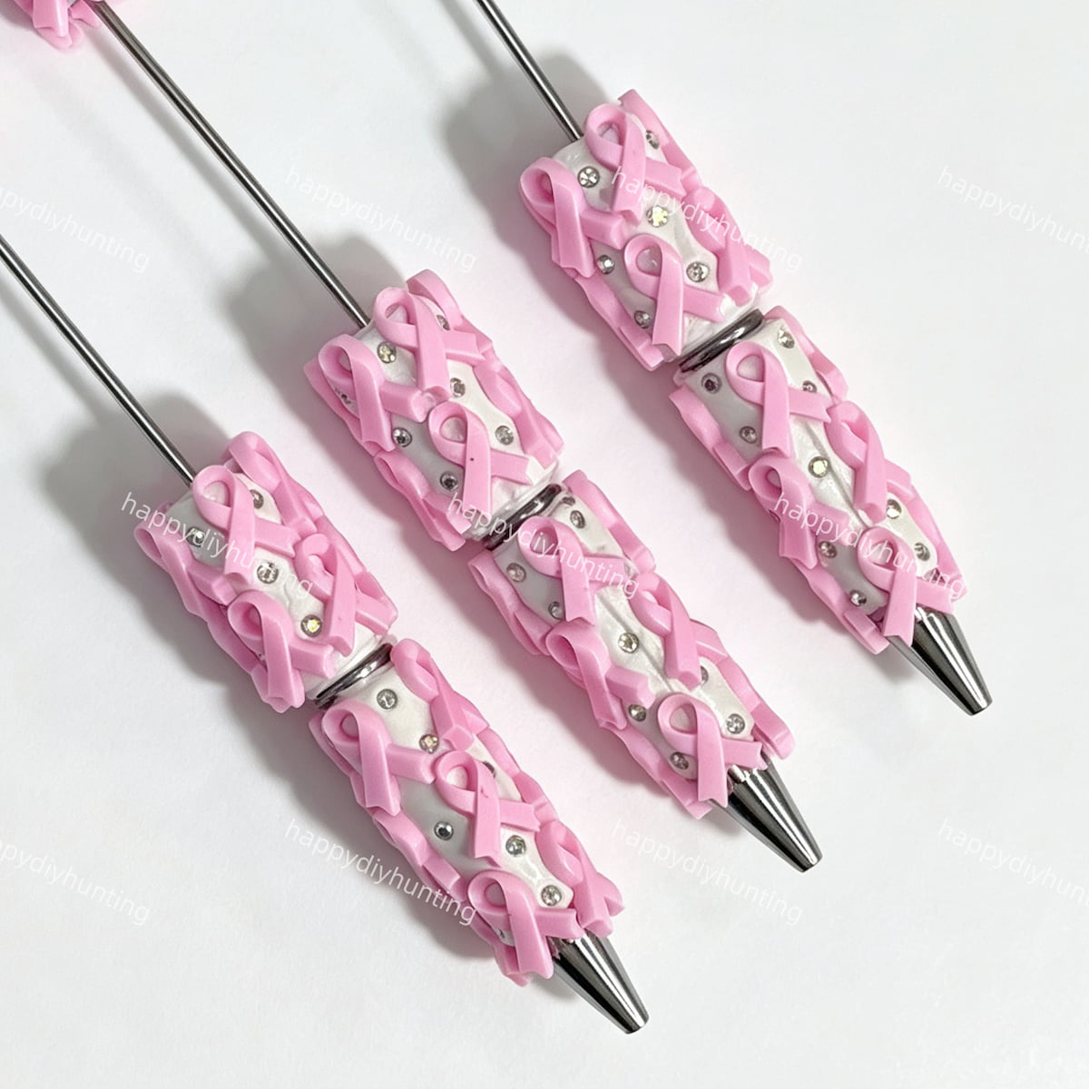 close-up pink bow print beadable pen showing bow design and beadable barrel