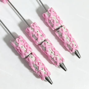 close-up pink bow print beadable pen showing bow design and beadable barrel