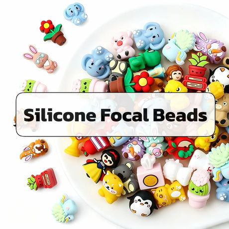 Collection of colorful silicone focal beads in various cute animal and plant designs.