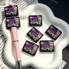 Square iced‑coffee floral silicone focal beads, black square silicone beads printed with coffee cup and flower graphics for beadable pens and pen toppers DIY craft projects