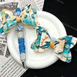 Teal‑orange dolphin print bow beads, decorative PU bow charms for beadable pens and handmade DIY craft projects