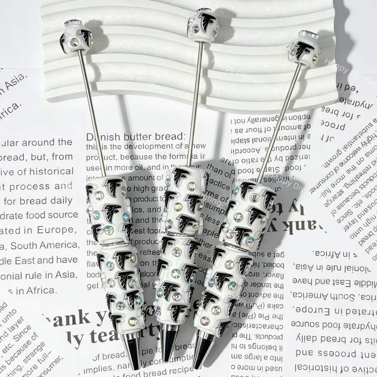 close-up white eagle bird AF football beadable pen showing eagle design and beadable barrel