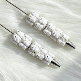 close-up white Richard beadable pen showing colorful Richard design and beadable barrel