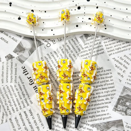 Bright yellow birthday candle relief beadable pens, raised candle motifs with white trim and multi‑color rhinestones, diy craft pen blanks
