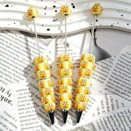 yellow cute cartoon character figurine bling beadable pens, cartoon themed pen bases for diy stationery craft and handmade gift making