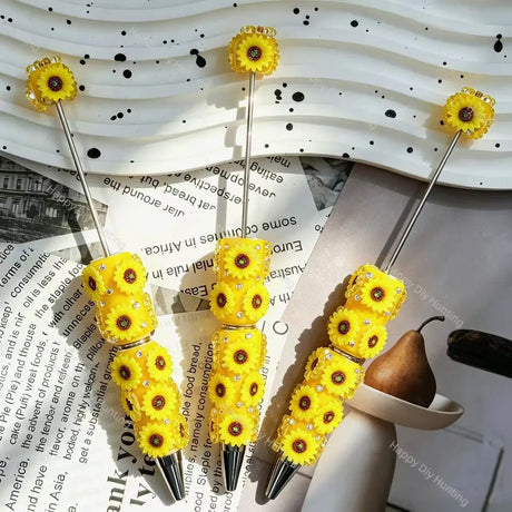 yellow sunflower 3d beadable pens floral theme with rhinestones on display for diy stationery and handmade gifts
